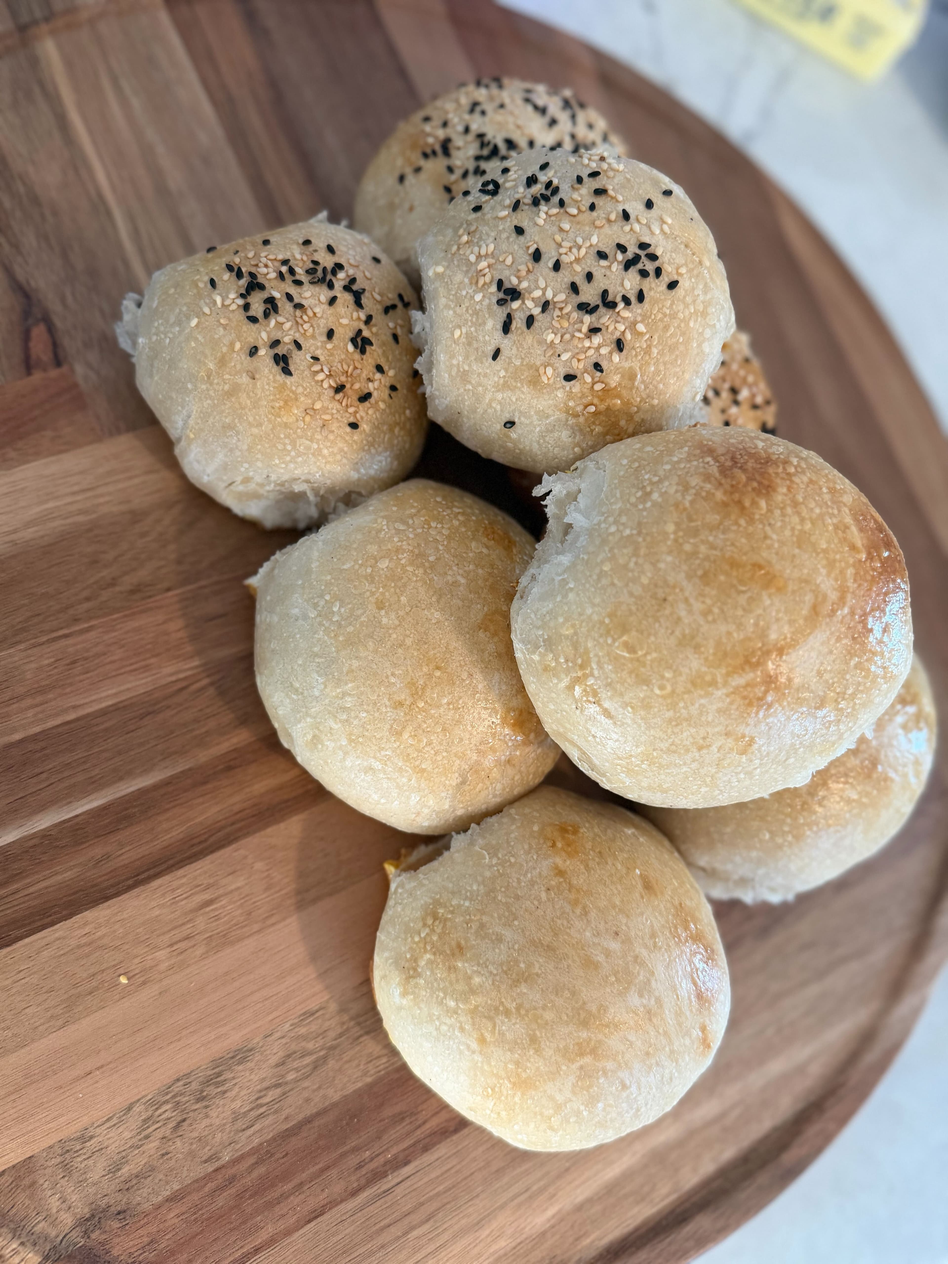Cluster of seeded sourdough rolls with sesame and poppy
