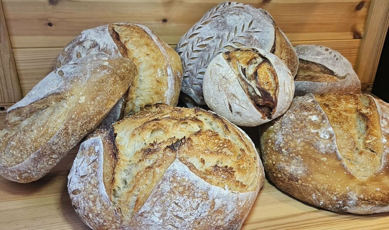Assortment of Auntie Lu's freshly baked artisan sourdough loaves